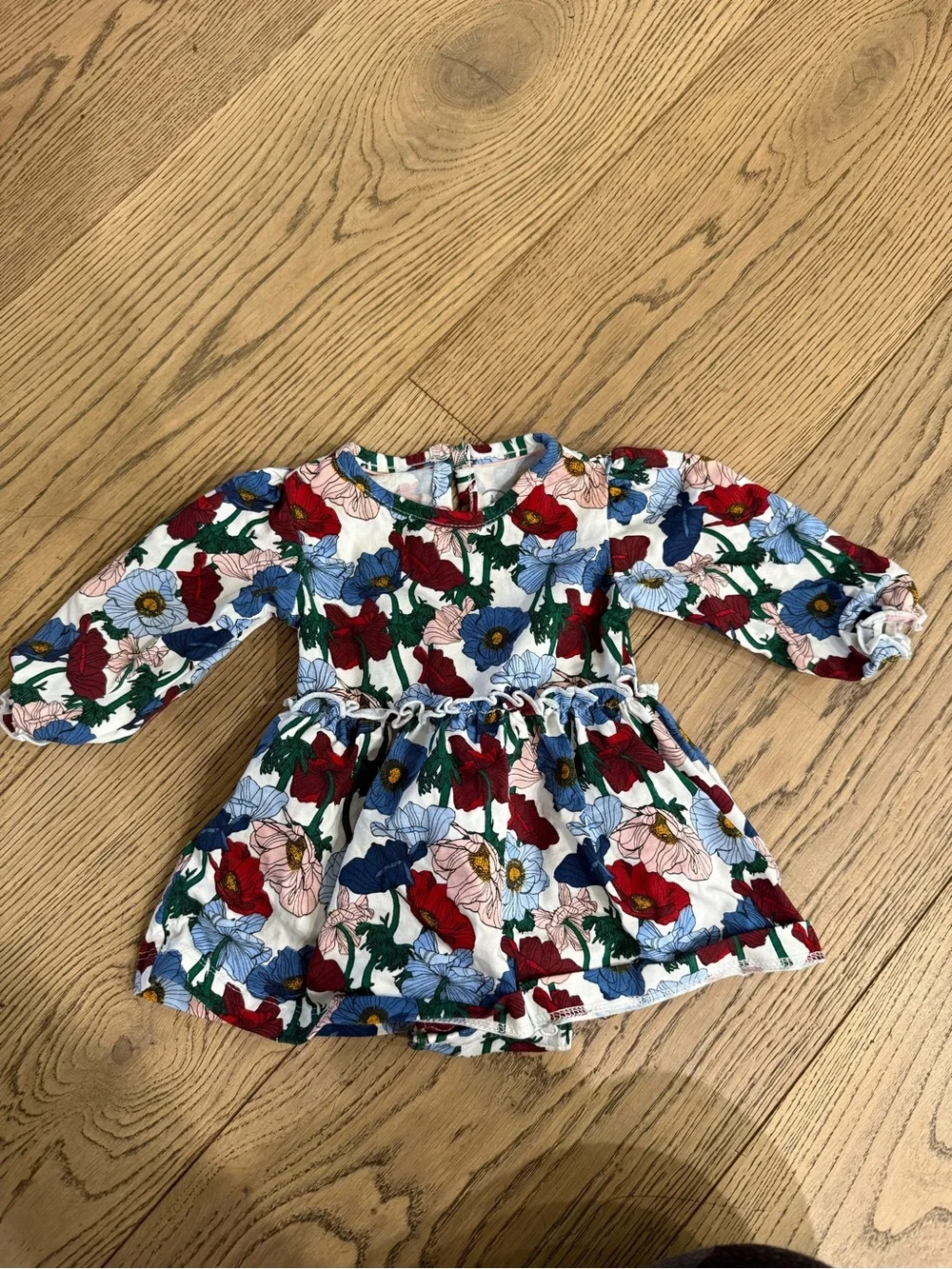 Rufflebutts Floral Bodysuit Dress Top - White with Red, Blue & Green Flowers